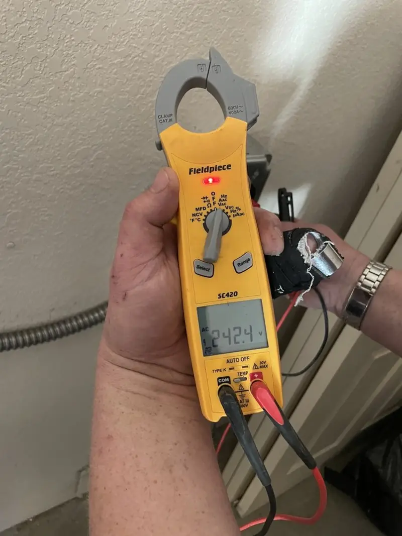 Voltage testing with clamp meter during Ceiling Fan Installation in Jena